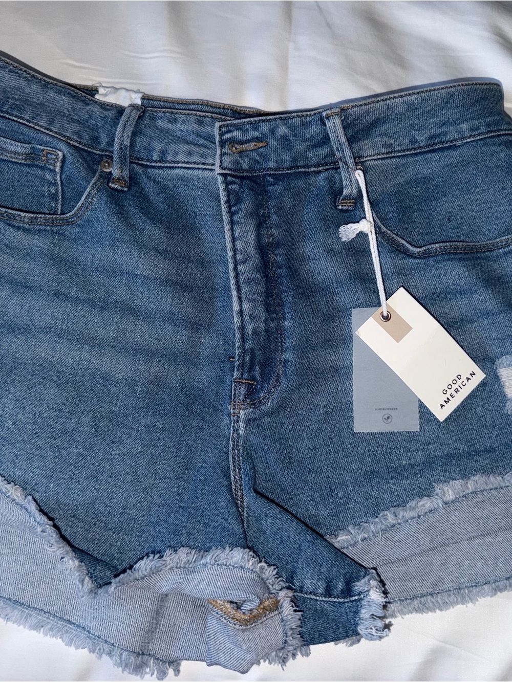 Good American Good Curce Medium Blue Distressed Denim Cutoff Shorts